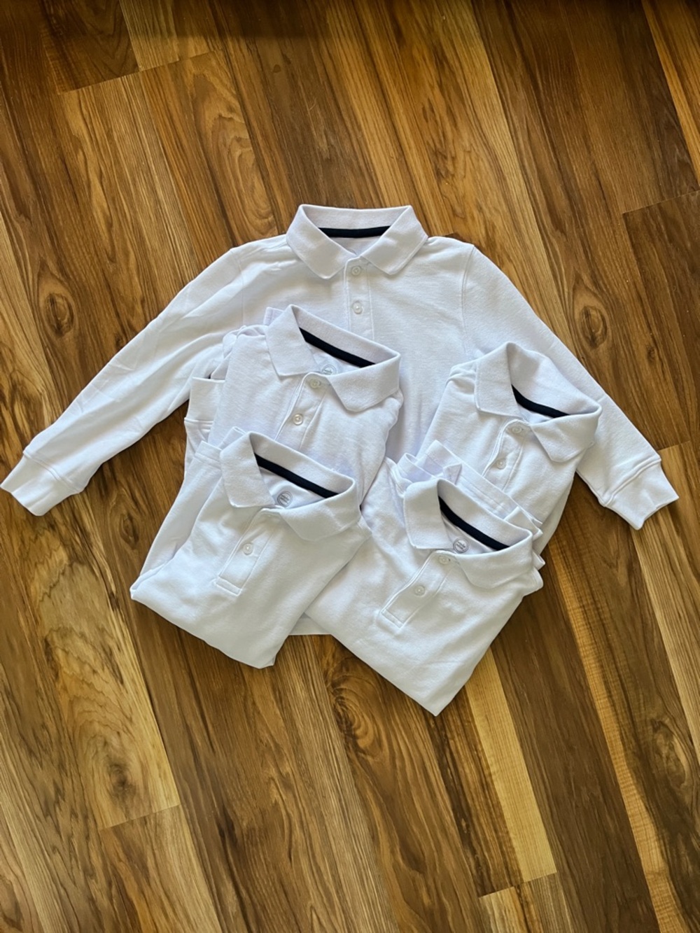 Boys uniform long sleeve polo shirts.